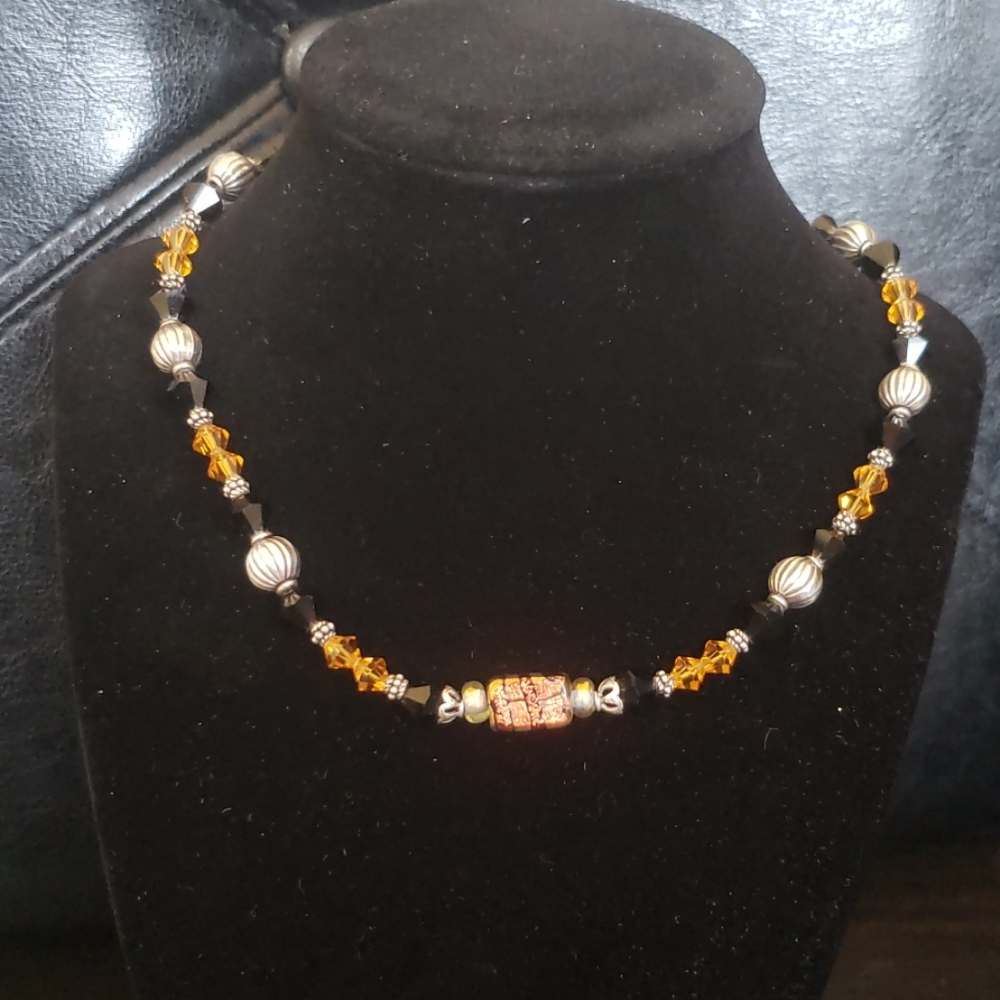 Black and amber necklace 
Beaded metal accents